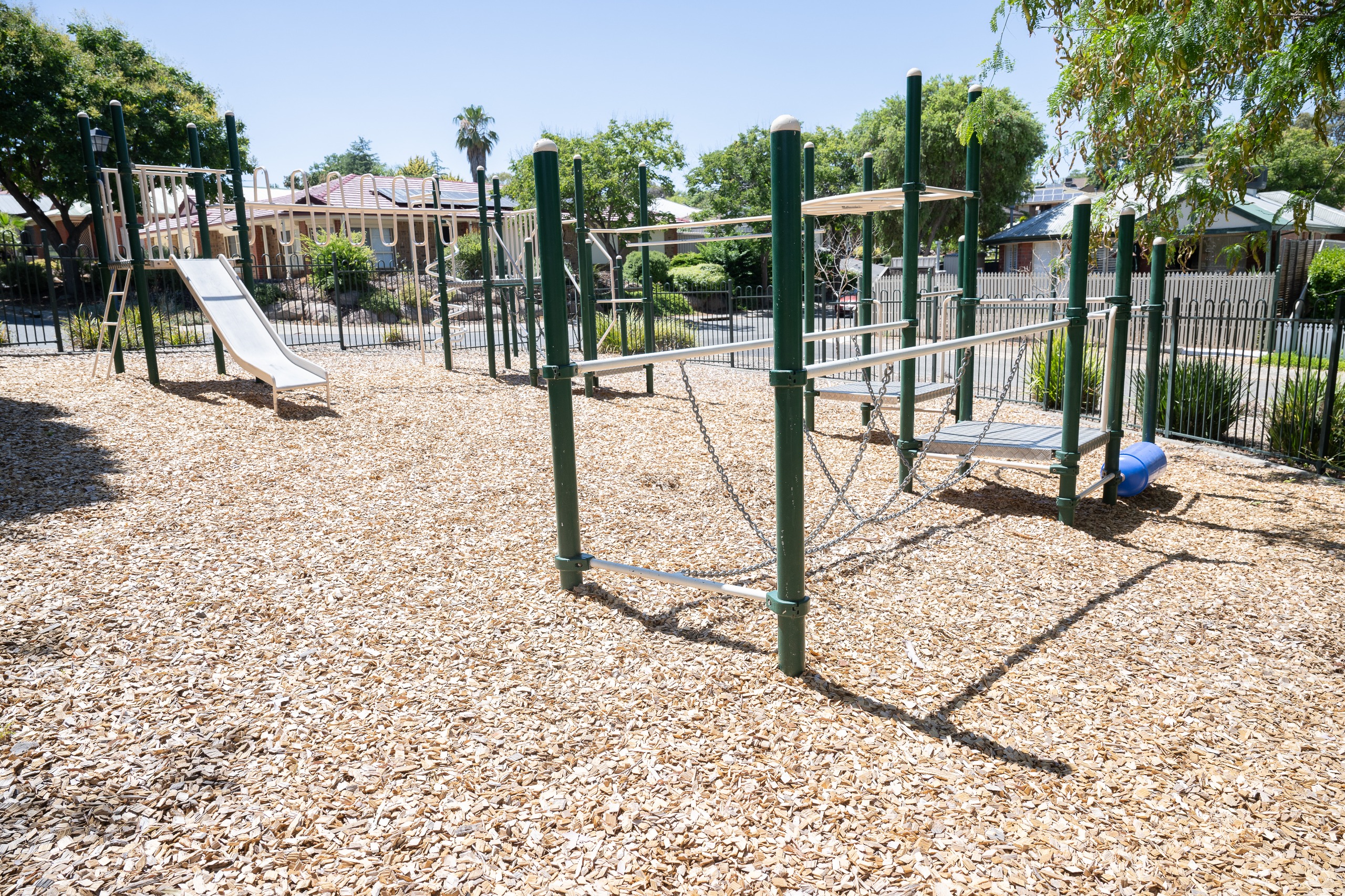 Play equipment showing a slide and structure for walking cross and climbing