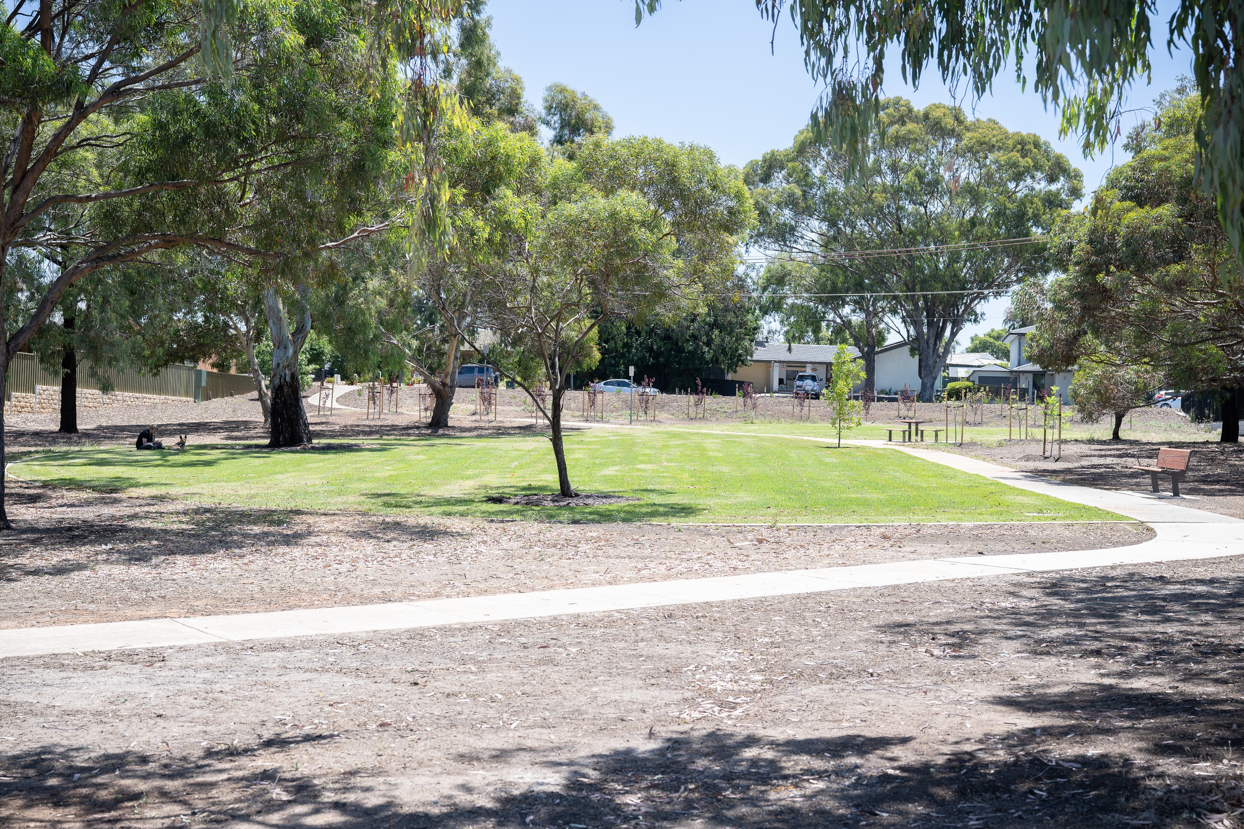 Park with grassed area, paths, seating and picnic setting